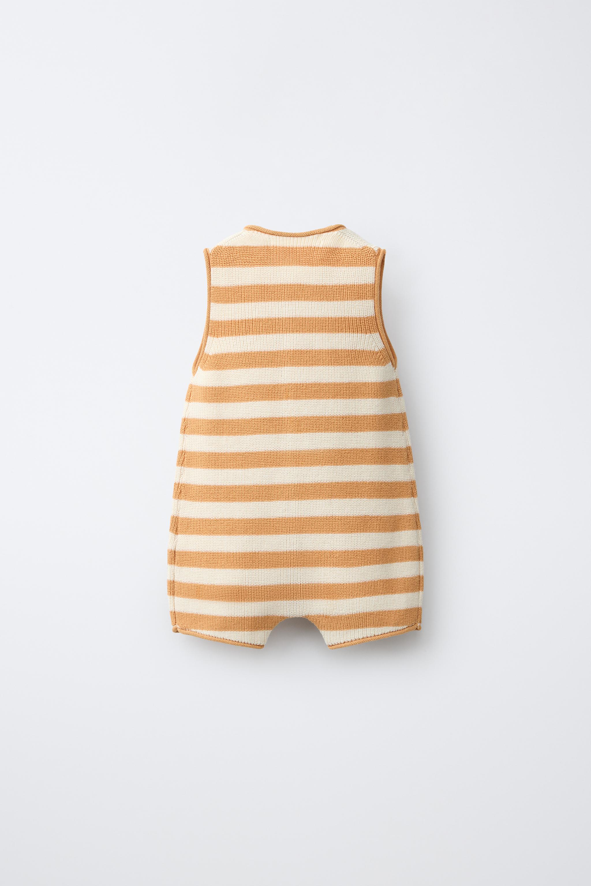 STRIPED KNIT ROMPER WITH EMBROIDERED BOAT